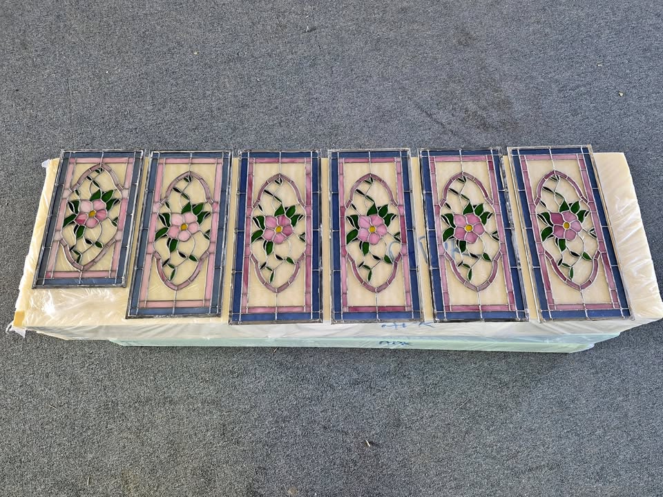 Six floral stained glass transom panels